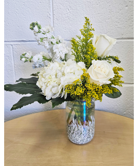 White flowers in a modern white opalescent vase